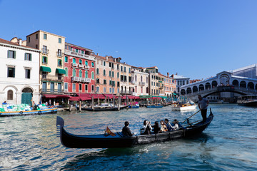 Venice, Italy. Gondola with tourists floats on Grand Canal