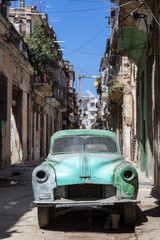 Rusty and broken old car abandoned in Havana