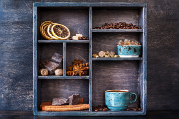 Spices, coffee and sweets in vintage wooden box