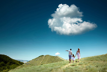 Obraz premium Family stay on the top of mountain, looking on the beautiful vie