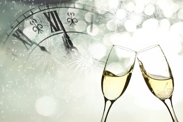 Glasses with champagne against fireworks