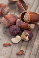 .hazelnuts with its shell on a wooden table