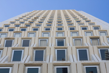 unusual perspective tall  building on a background of blue sky