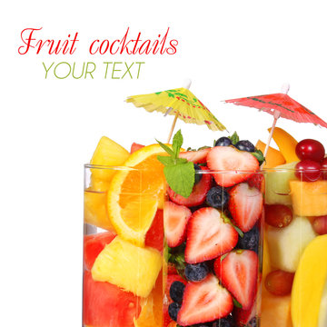 Fruit cocktails isolated. Fresh slices of  fruits in glass