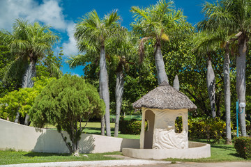 Fototapeta premium white cozy shed against the tropical garden