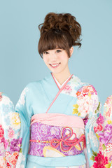 Beautiful asian kimono woman on blue background