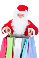 Surprised santa looking inside shopping bag