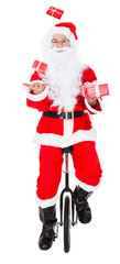 Santa juggling on monocycle