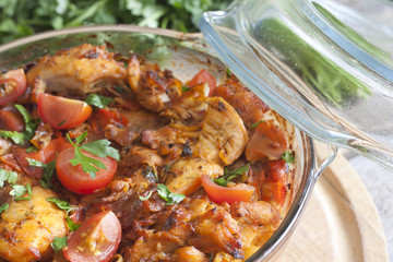 Casserole of chicken in an ovenproof dish with vegetables