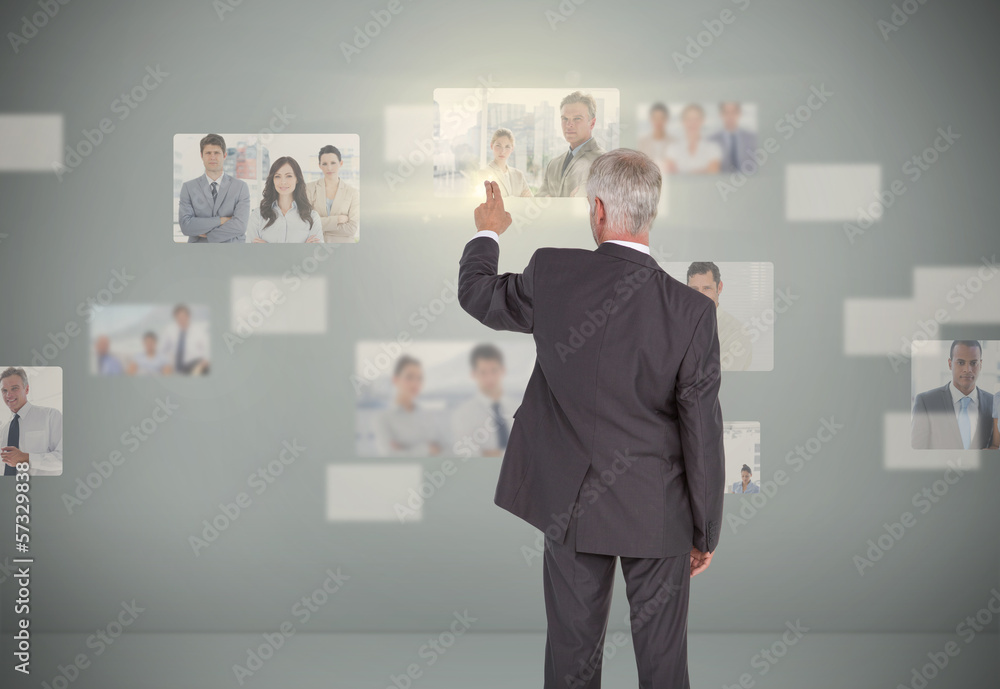 Poster classy businessman selecting futuristic interface