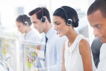 Call center employees at work on futuristic hologram interfaces