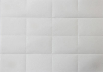 paper folded into 16 cells. Background