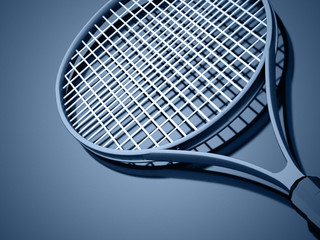 Tennis racket on blue