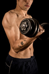 Fototapeta na wymiar Young athletic bodybuilder exercising