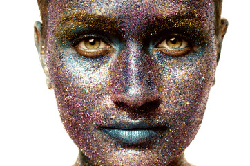 Beautiful face of a woman covered in glitter