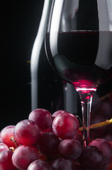 grape and glass with red wine