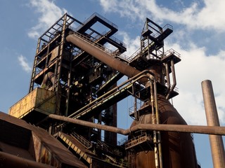 Fototapeta na wymiar Old rusty industry pipes in Ostrava Vitkovice region