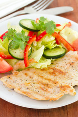 grilled turkey with vegetables on plate