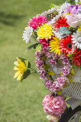 bicycle with a bucket of colorful flowers,