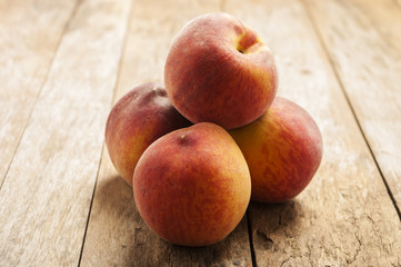 peaches in wooden background