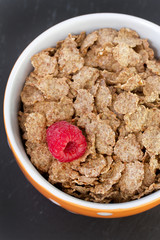 flakes with raspberry  in bowl