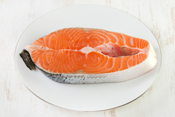 fresh salmon on white plate