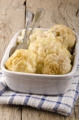 cauliflower with melted cheese in a bowl