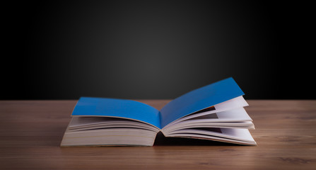 Open book on wooden deck