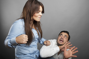 Girl threatens with a fist his boyfriend