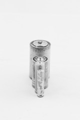 Old batteries on white background