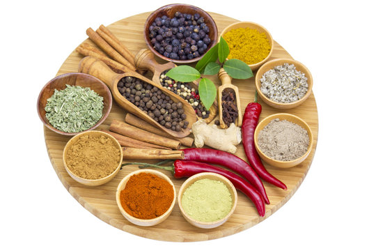 Variety of spices on wooden board
