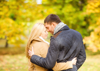 Fototapeta premium romantic couple kissing in the autumn park