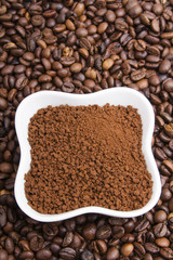 instant coffee on coffee beans background