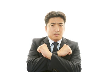 禁止の意思表示をするビジネスマン