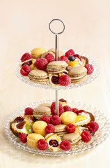 Two level dessert stand full of sweets. Selective focus