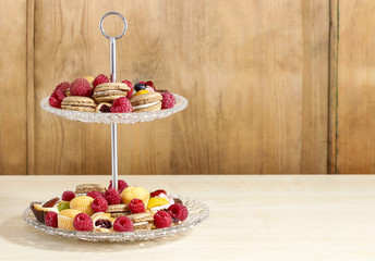 Two level dessert stand full of sweets. Selective focus © agneskantaruk