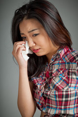 Portrait of sexy asian cowgirl crying