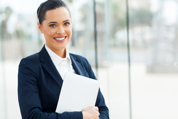 young businesswoman holding laptop