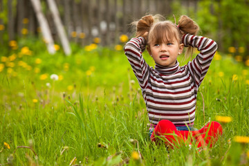 Funny lovely little five-year girl in park