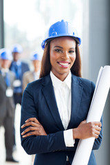 young african construction manager holding blue print