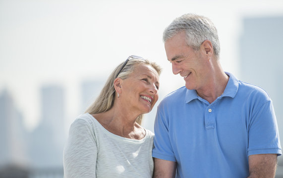 Loving Senior Couple Smiling Outdoors