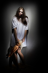 Crazy girl with doll
