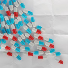 Pills spilling out of pill bottle