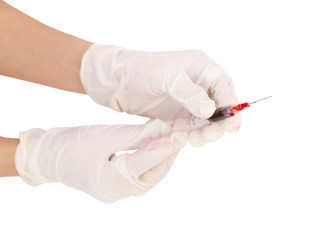 syringe with blood in hand on white background