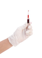 syringe with blood in hand on white background