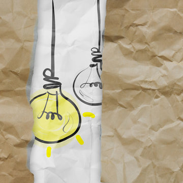 light bulb crumpled paper and recycle tear envelope as creative