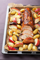 pork baked with vegetables on a tray