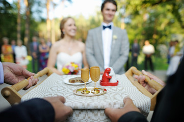 Bride and groom being met by parents