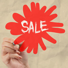 word sale with crumpled pape rbackground