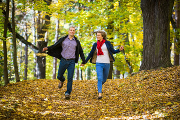 Urban leisure - woman and man running in park